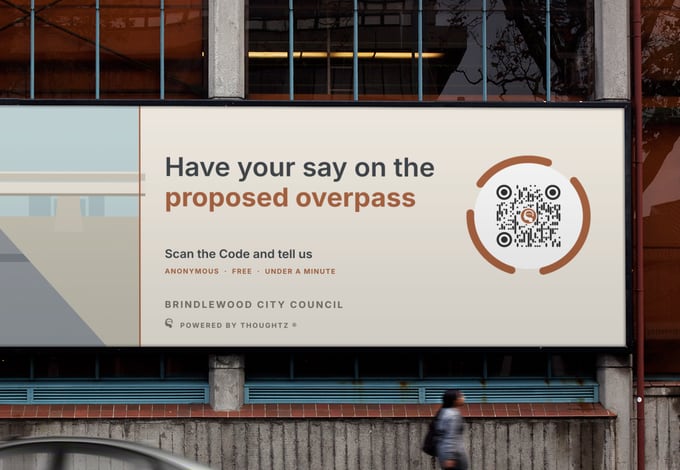 A roadside billboard reading Have your say on the proposed overpass, with a large Thoughtz Code.
