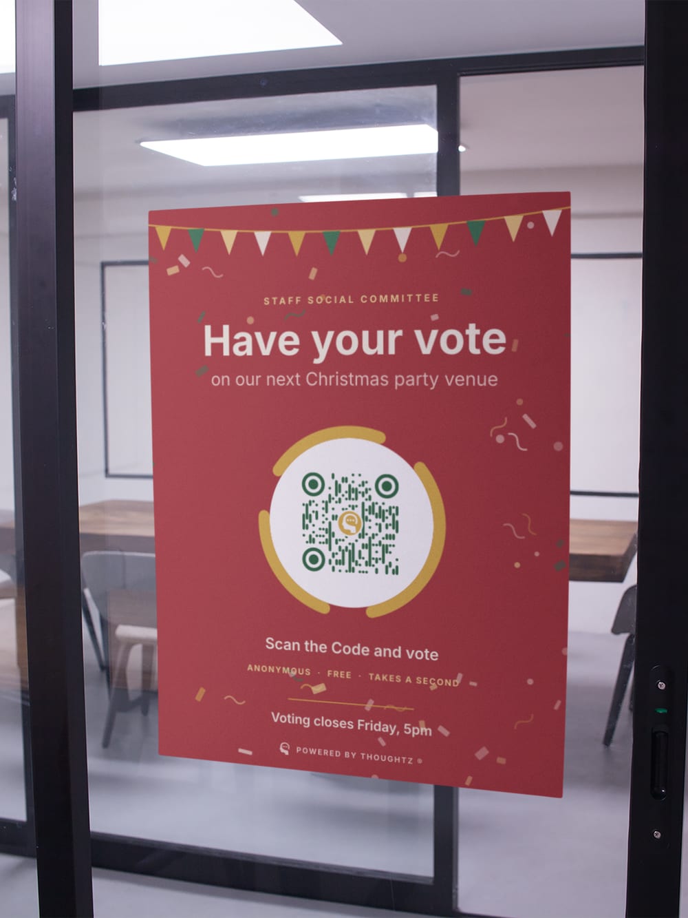 A poster on a glass office door asking staff to vote on the next Christmas party venue, with a large Thoughtz Code.